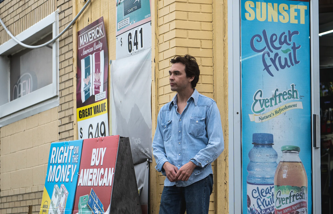 Musician Ben Stalets stands outside a Toledo convenience store. 